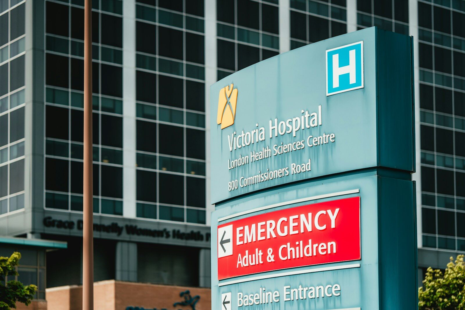 Victoria hospital emergency entrance sign with building